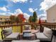 Inviting deck with comfortable seating and a view of the lush backyard and blue sky at 105 Pink Dogwood Ln, Mebane, NC 27302