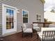 Cozy deck area featuring comfortable seating, accessible through a glass door, perfect for relaxation at 105 Pink Dogwood Ln, Mebane, NC 27302