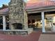 Picturesque outdoor fireplace with an adjacent lounge area and ample seating at 105 Pink Dogwood Ln, Mebane, NC 27302