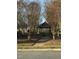 Scenic gazebo nestled among trees and foliage creating a tranquil outdoor space at 105 Pink Dogwood Ln, Mebane, NC 27302