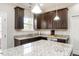 Stylish kitchen features granite counters, stainless steel appliances, and dark wood cabinets at 105 Pink Dogwood Ln, Mebane, NC 27302