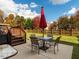 Inviting backyard patio with a dining set, steps to the deck, and a view of the fenced yard at 105 Pink Dogwood Ln, Mebane, NC 27302