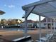 Community pool area with lounge chairs and pergola for shade; a perfect spot to relax at 105 Pink Dogwood Ln, Mebane, NC 27302