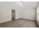Bedroom boasts high ceilings, wood-look floors, neutral walls, and plenty of natural light at 107 Meeting Hall Dr, Morrisville, NC 27560