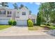 Charming two-story home with a well-manicured lawn and attached two-car garage, perfect for a Gathering at 107 Meeting Hall Dr, Morrisville, NC 27560
