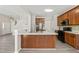 Modern kitchen featuring an island, stainless steel appliances, and ample counter space, perfect for cooking at 107 Meeting Hall Dr, Morrisville, NC 27560