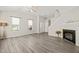 Bright and spacious living room with high ceilings, hardwood floors, fireplace, and ample natural light at 107 Meeting Hall Dr, Morrisville, NC 27560