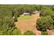 Aerial view of private residence with large yard and acreage in a wooded location at 108 Cedarwood Dr, Louisburg, NC 27549