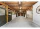 Interior of horse barn with exposed rafters and individual stalls at 108 Cedarwood Dr, Louisburg, NC 27549