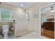 Modern bathroom features tiled walk-in shower, toilet, and neutral wall color at 108 Cedarwood Dr, Louisburg, NC 27549