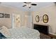 Comfortable bedroom showing ensuite bathroom and a decorative dresser at 108 Cedarwood Dr, Louisburg, NC 27549