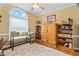 Comfortable home office features built-in bookshelves and a large window at 108 Cedarwood Dr, Louisburg, NC 27549