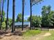 Horse barn and paddock with wooden fence line, offering an equestrian lifestyle and outdoor enjoyment at 108 Cedarwood Dr, Louisburg, NC 27549