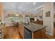 Open concept kitchen island with granite countertops and stainless steel dishwasher at 108 Cedarwood Dr, Louisburg, NC 27549