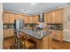 Spacious kitchen featuring a center island, stainless appliances and custom cabinets at 108 Cedarwood Dr, Louisburg, NC 27549