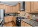 Well-equipped kitchen featuring stainless steel appliances and granite countertops at 108 Cedarwood Dr, Louisburg, NC 27549