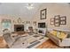 Inviting living room showcasing a brick fireplace and cozy seating arrangements at 108 Cedarwood Dr, Louisburg, NC 27549
