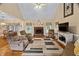 Spacious living room featuring a brick fireplace and comfortable seating at 108 Cedarwood Dr, Louisburg, NC 27549