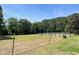 Spacious pasture with wooden fence line and lush greenery, ideal for horses, or recreation at 108 Cedarwood Dr, Louisburg, NC 27549