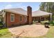 Paver patio in the backyard of a single Gathering home with lush green lawn at 108 Cedarwood Dr, Louisburg, NC 27549