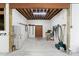 Well-lit tack room with ample storage, work table, and organized gear, creating a practical and efficient space at 108 Cedarwood Dr, Louisburg, NC 27549