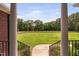 View from the front porch showcasing an extensive yard and equestrian fencing at 108 Cedarwood Dr, Louisburg, NC 27549