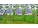 An aerial view shows the backyard, with a black fence, surrounding homes, and neighborhood streets at 1096 Aberlour Ln, Burlington, NC 27215