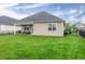 The backyard features a well-maintained lawn and covered patio area for outdoor relaxation at 1096 Aberlour Ln, Burlington, NC 27215