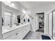 Spacious bathroom with dual sinks, modern fixtures, and a walk-in closet at 1096 Aberlour Ln, Burlington, NC 27215