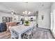 Open-concept dining room with an adjacent kitchen and living room space at 1096 Aberlour Ln, Burlington, NC 27215