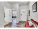 Inviting foyer with hardwood floors, a red bench, and a view into the bright living spaces at 1096 Aberlour Ln, Burlington, NC 27215