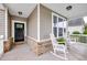 Inviting front porch with rocking chairs, perfect for relaxing and enjoying the neighborhood views at 1096 Aberlour Ln, Burlington, NC 27215