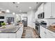 Spacious kitchen with a large island, granite countertops, stainless steel appliances, and white cabinetry at 1096 Aberlour Ln, Burlington, NC 27215