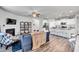 Open concept living space with fireplace, adjacent kitchen and dining area, and lots of natural light at 1096 Aberlour Ln, Burlington, NC 27215