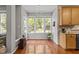 Bright breakfast nook with hardwood floors and lots of natural light at 110 Fairchild Downs Pl, Cary, NC 27518