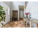 Inviting foyer with tile flooring, coat rack, and stairs leading to upper level at 110 Fairchild Downs Pl, Cary, NC 27518