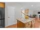 Kitchen island with granite countertop and wood cabinetry at 110 Fairchild Downs Pl, Cary, NC 27518