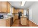 Well-equipped kitchen features granite countertops, stainless steel appliances, and a central island at 110 Fairchild Downs Pl, Cary, NC 27518