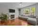 Bright living room featuring fireplace, hardwood floors and lots of natural light at 110 Fairchild Downs Pl, Cary, NC 27518
