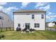 Spacious backyard featuring a seating area, lush grass, and a stylish fence for privacy at 1101 Hazelmist Dr, Youngsville, NC 27596