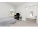 Carpeted spare bedroom with a TV on top of a dresser at 1101 Hazelmist Dr, Youngsville, NC 27596