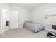 Spare bedroom with plush carpet and large window at 1101 Hazelmist Dr, Youngsville, NC 27596