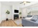 Comfortable living room features a fireplace, stylish furniture, and great natural light at 1101 Hazelmist Dr, Youngsville, NC 27596