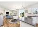 Open-concept living space with a dining area, living room, and access to the backyard at 1101 Hazelmist Dr, Youngsville, NC 27596