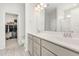 Modern main bathroom with double sink vanity, stylish floor tiles and walk in closet at 1101 Hazelmist Dr, Youngsville, NC 27596