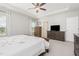 Comfortable main bedroom with neutral carpet and ceiling fan at 1101 Hazelmist Dr, Youngsville, NC 27596