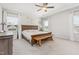 Spacious main bedroom with ample natural light, a ceiling fan, and a tray ceiling at 1101 Hazelmist Dr, Youngsville, NC 27596