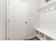 Charming mudroom with a built-in bench, storage cubbies, and convenient coat hooks at 1101 Hazelmist Dr, Youngsville, NC 27596