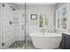 Beautiful bathroom with walk in shower, free standing tub, and natural light at 111 Chancellors Ridge Dr, Durham, NC 27713