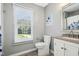 Bathroom with a window, toilet, and vanity with great natural light at 111 Chancellors Ridge Dr, Durham, NC 27713